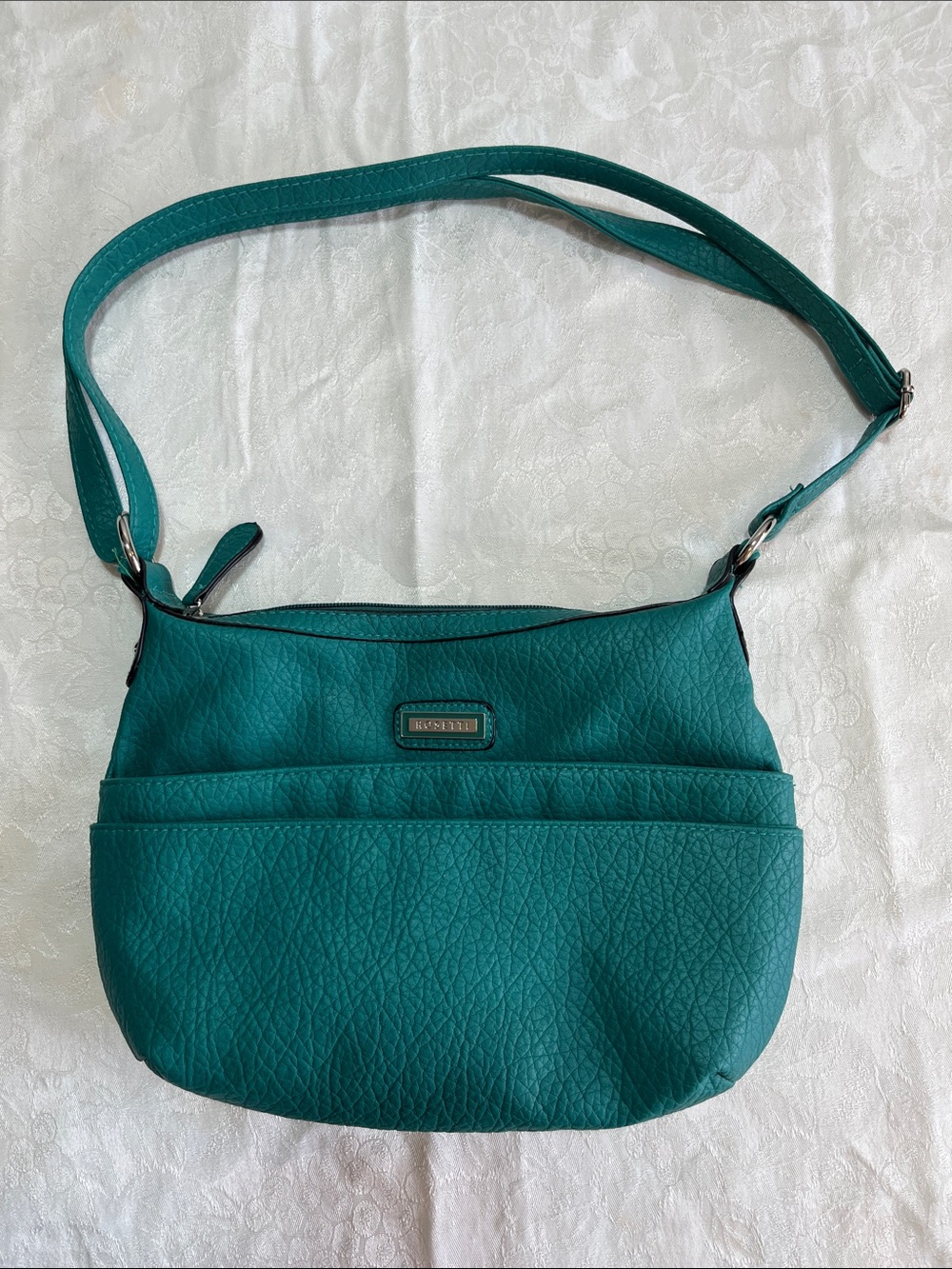 Rosetti Oakley Teal Green Pebbled Shoulder Bag with 3 zipper pockets.